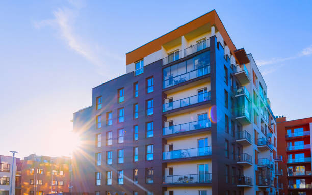 Apartment in residential building exterior. Housing structure at blue modern house of Europe. Rental home in city district on summer. Architecture for business property investment, Vilnius, Lithuania.